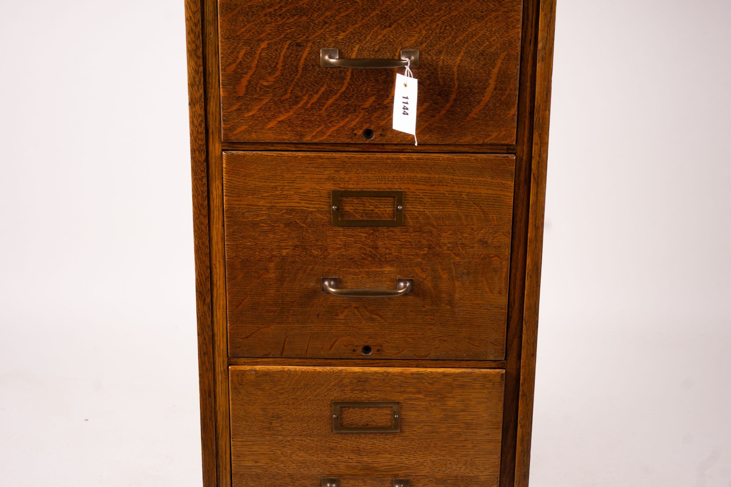 An early 20th century oak four drawer filing cabinet, W.44cm D.70cm. H.132cm